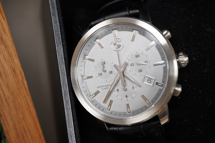 A small group of assorted mainly costume jewellery and wrist watches, including two silver hinged bangles, green enamel necklace and BMW quartz chronograph wrist watch.